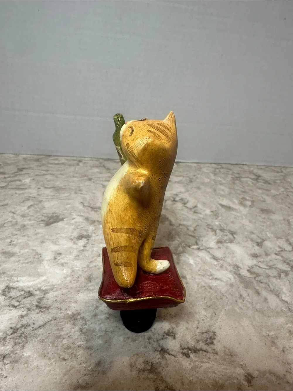 Yellow Cat Figurine Holding Bottle on Red Cushion- Bottle Stopper